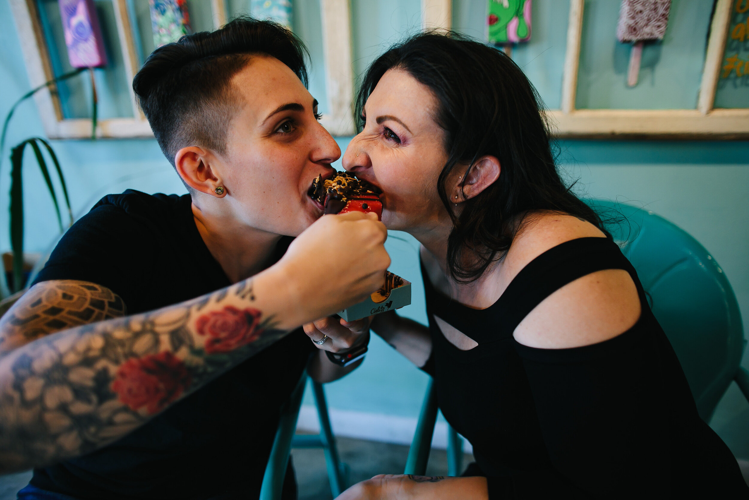 Adorable-couple-sharing-ice-cream-wynwood-engagement-session-tiny-house-photo