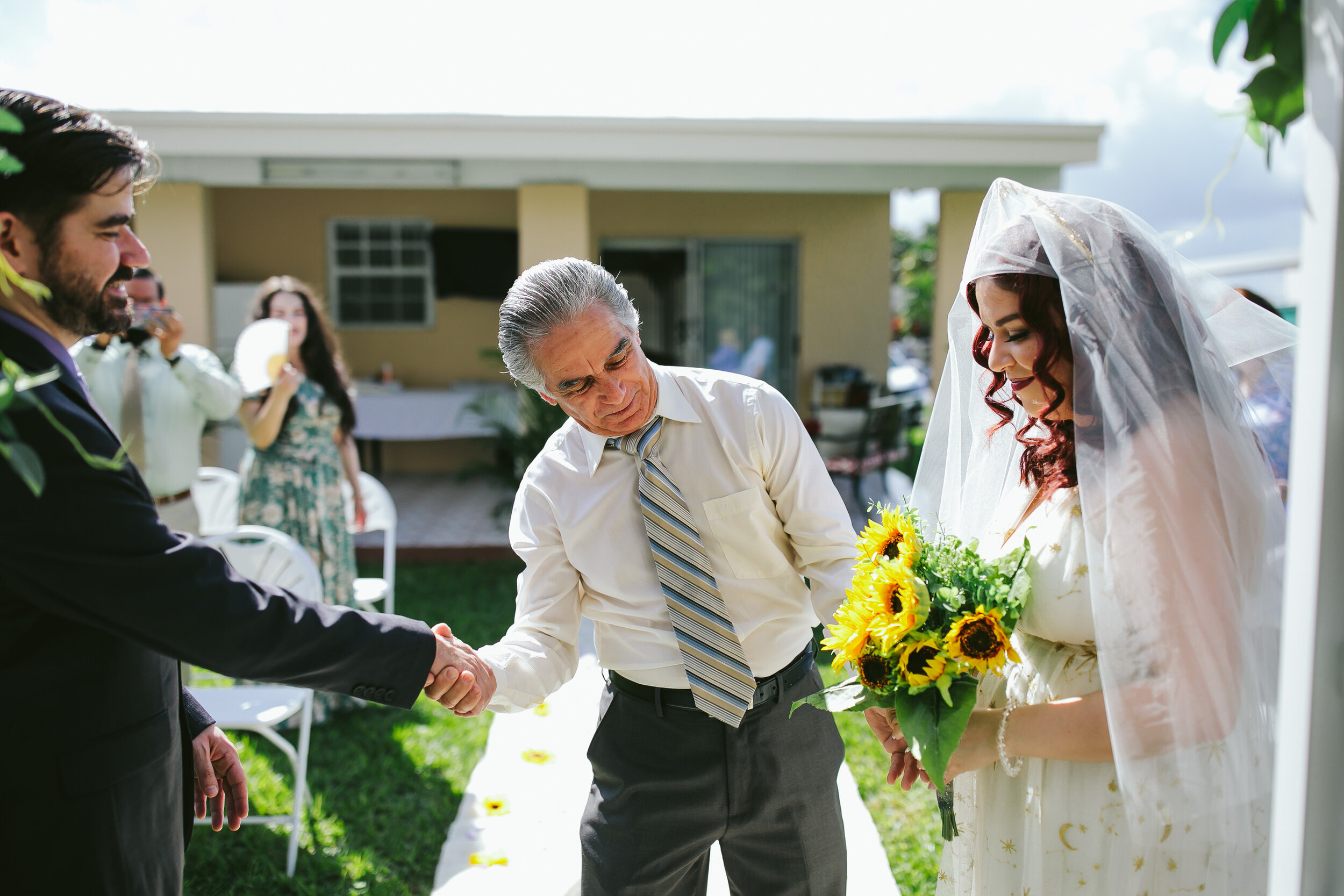 Dad-Shaking-Grooms-Hand-Backyard-Wedding-Ceremony-Homestead-Florida