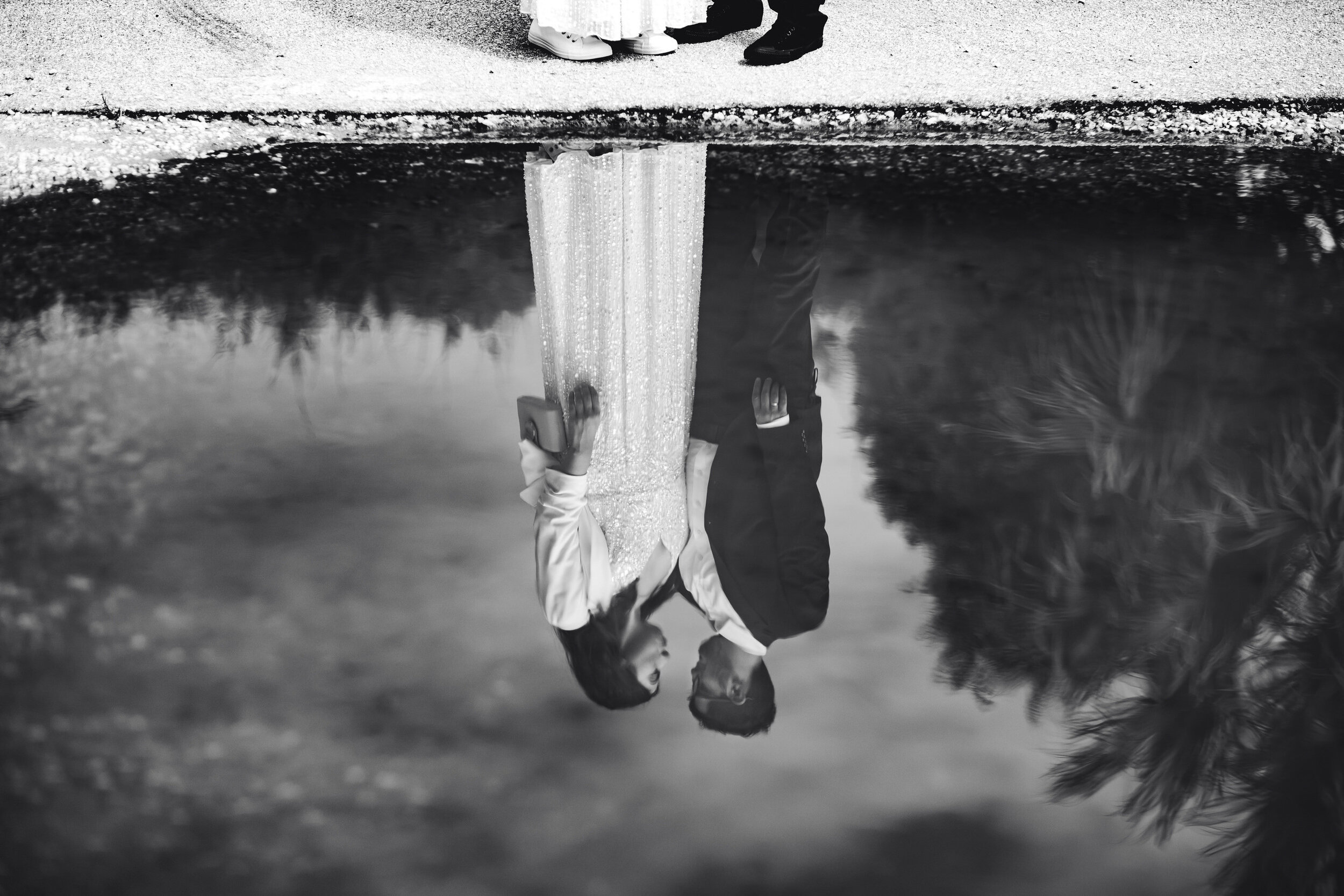 Black-and-white-portrait-bride-groom-puddle-reflection-palm-beach-elopement