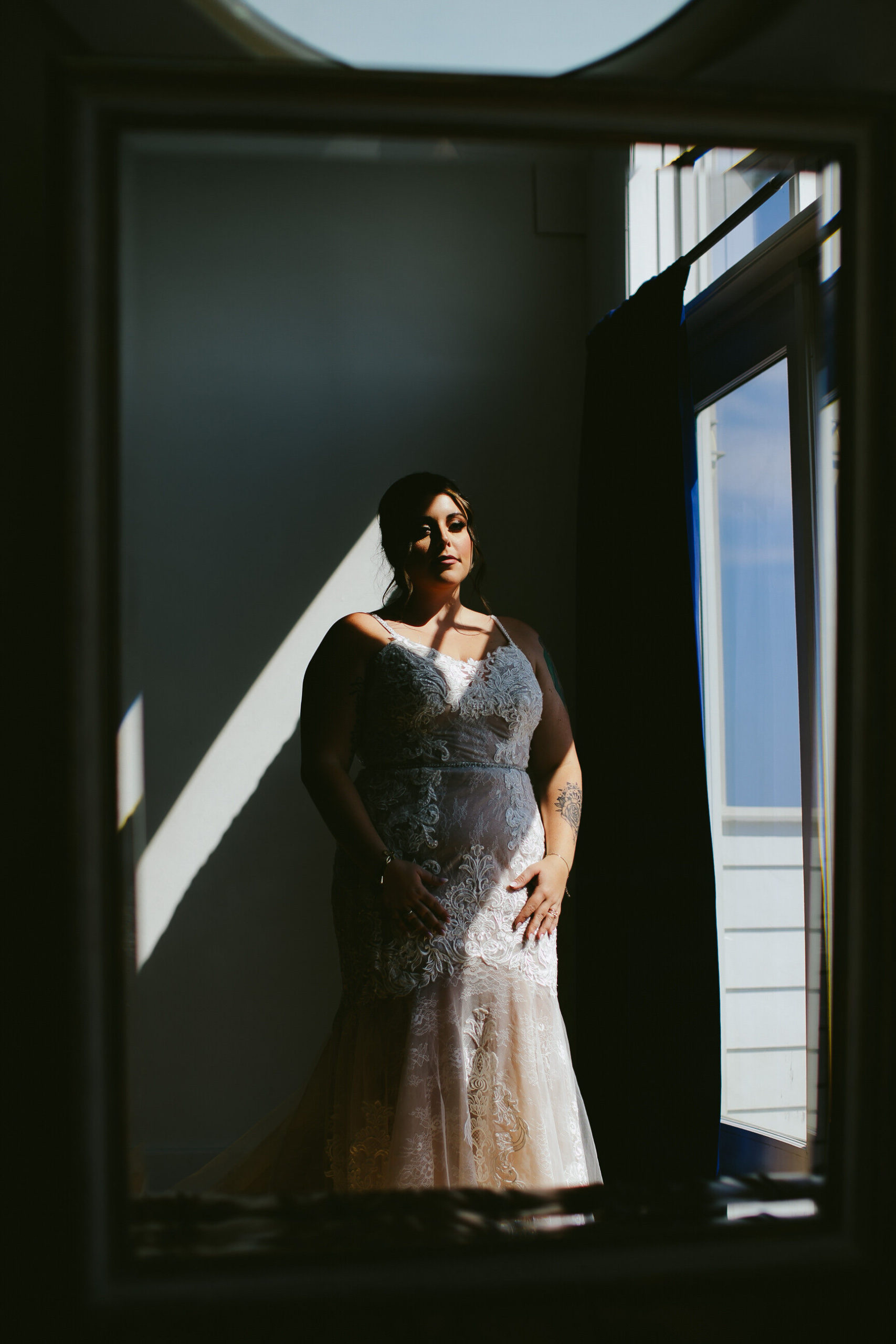 Bride-Looking-in-mirror-in-wedding-dress