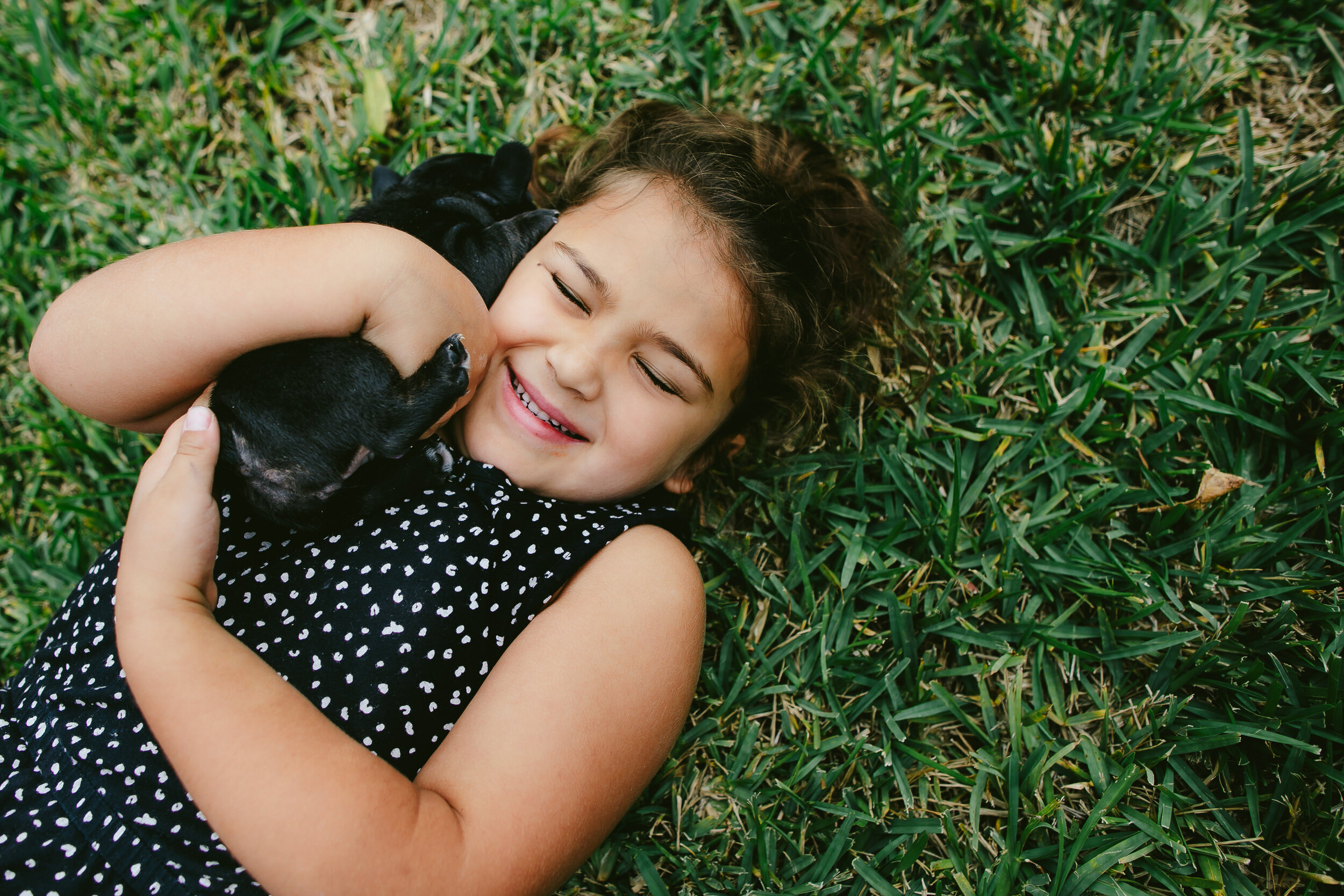 Girl-and-her-puppy-cuddles-happy-joy-Florida-family-photographer