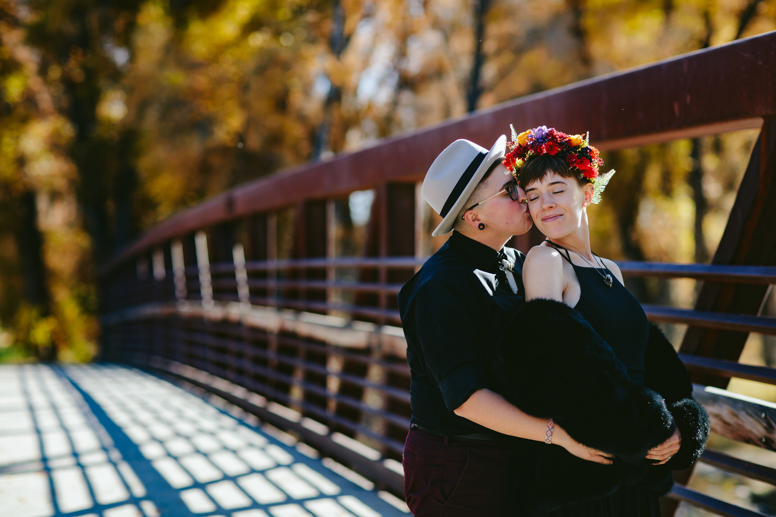 Just Married Couple Snuggling on a Bridge in Fall in Colorado
