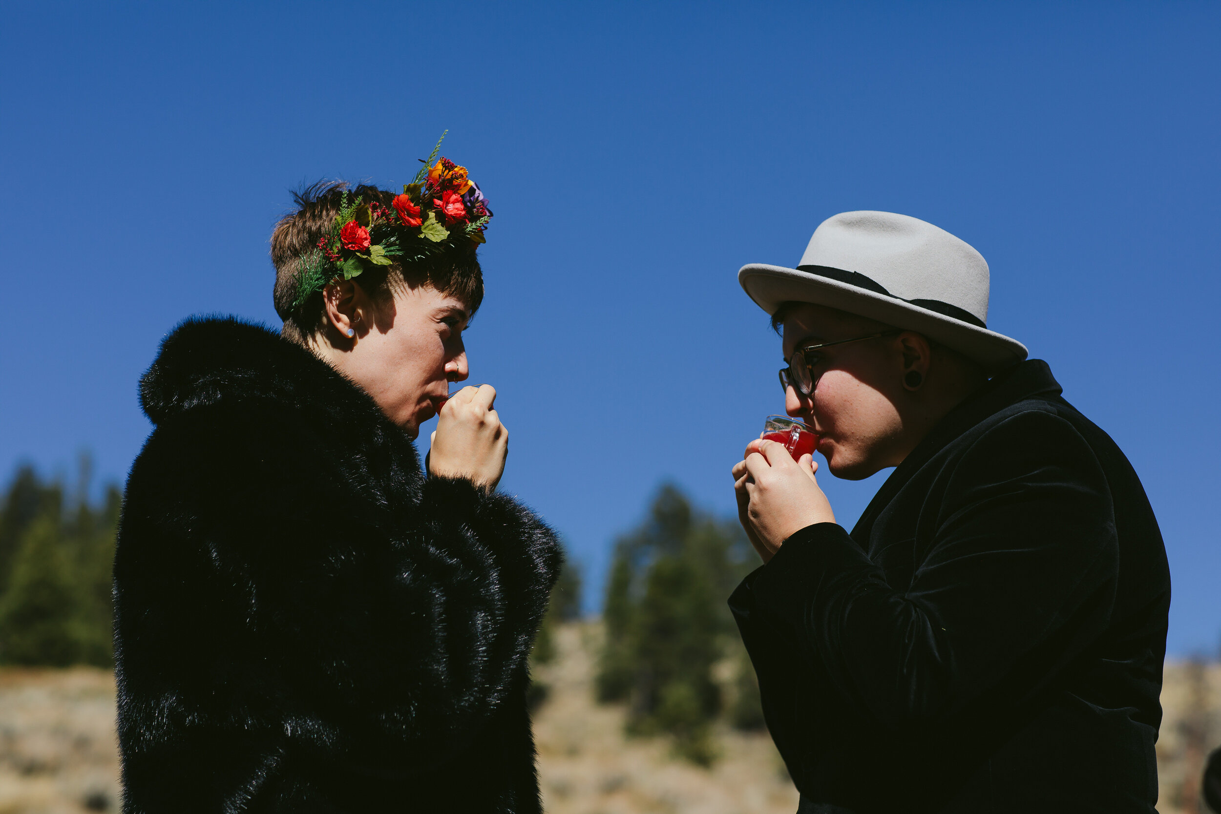 Queer Wiccan Couple Drinking Love Potion during Elopement Ceremony