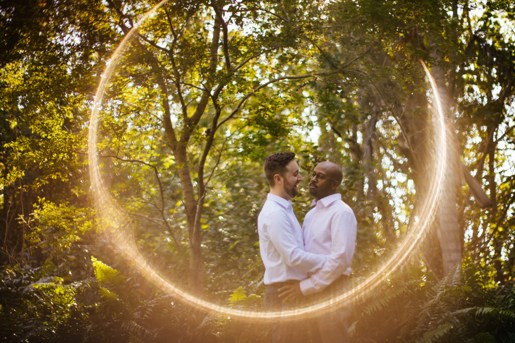 Unique Engagement Portrait of Two Grooms Hugging in Nature in South Florida