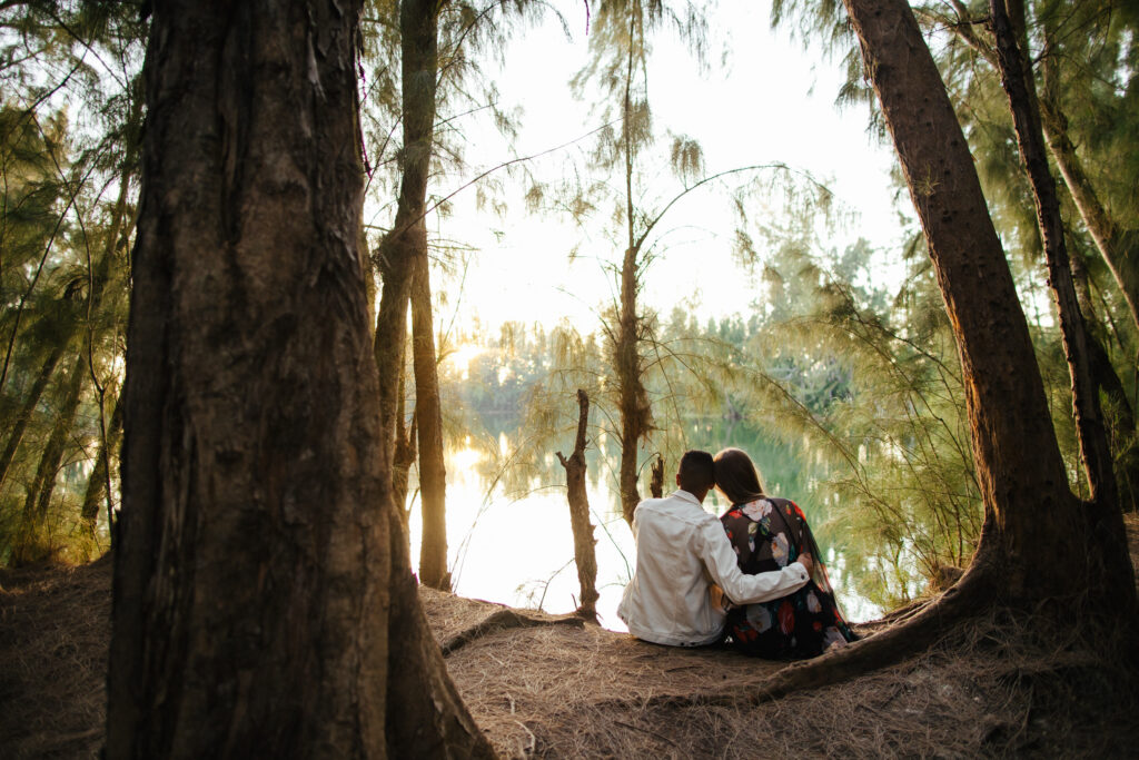 Couple hugging lakeside in South Florida Engagement Photos