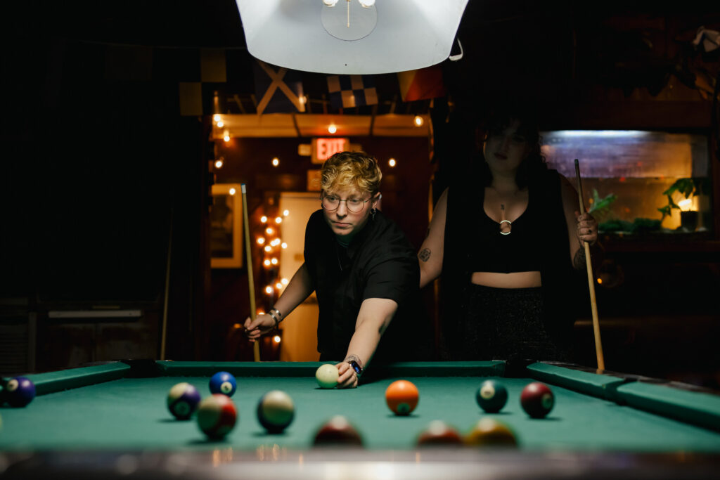 Queer Couple shooting pool at a Dive Bar Engagement Session