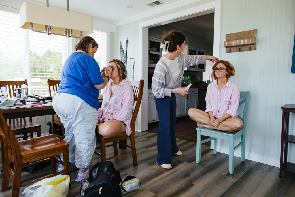 Two Brides having their hair and makeup done at their Destination Wedding in Alabama