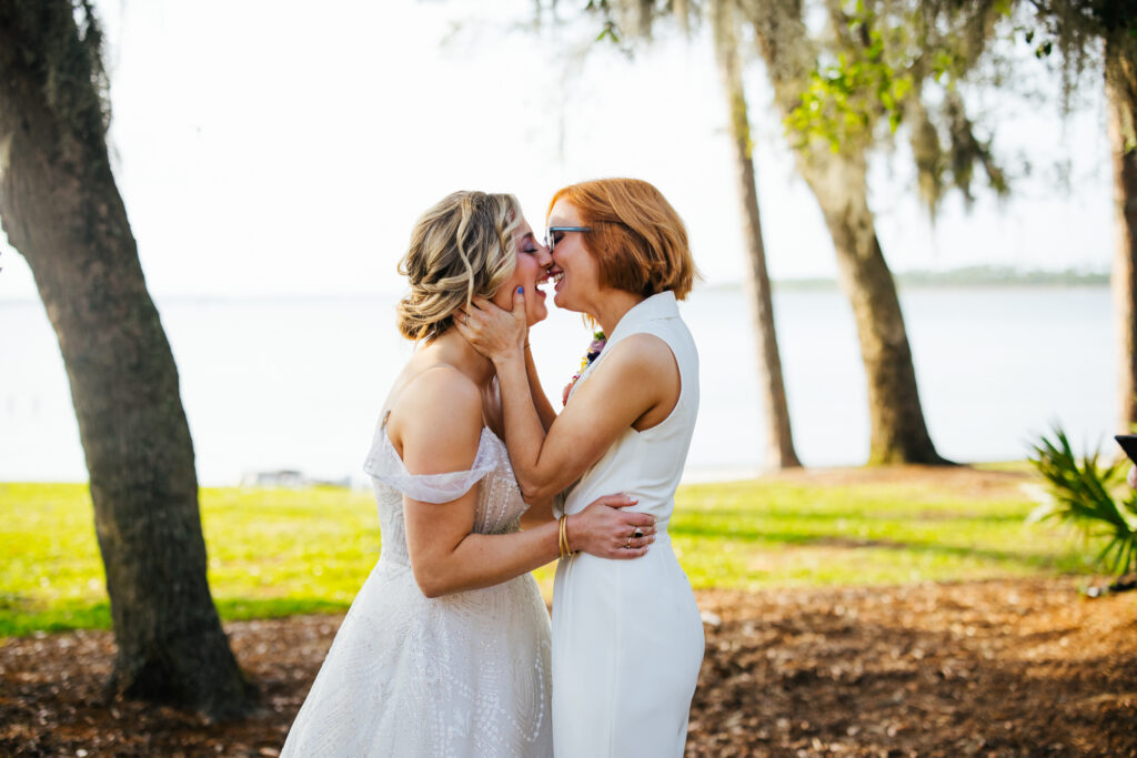 Lesbian Wedding First Kiss Garden Wedding Ceremony Coastal Arts Center Alabama