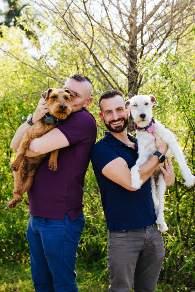 LGBTQ+ Couple with their two dogs at Wilton Manors Park