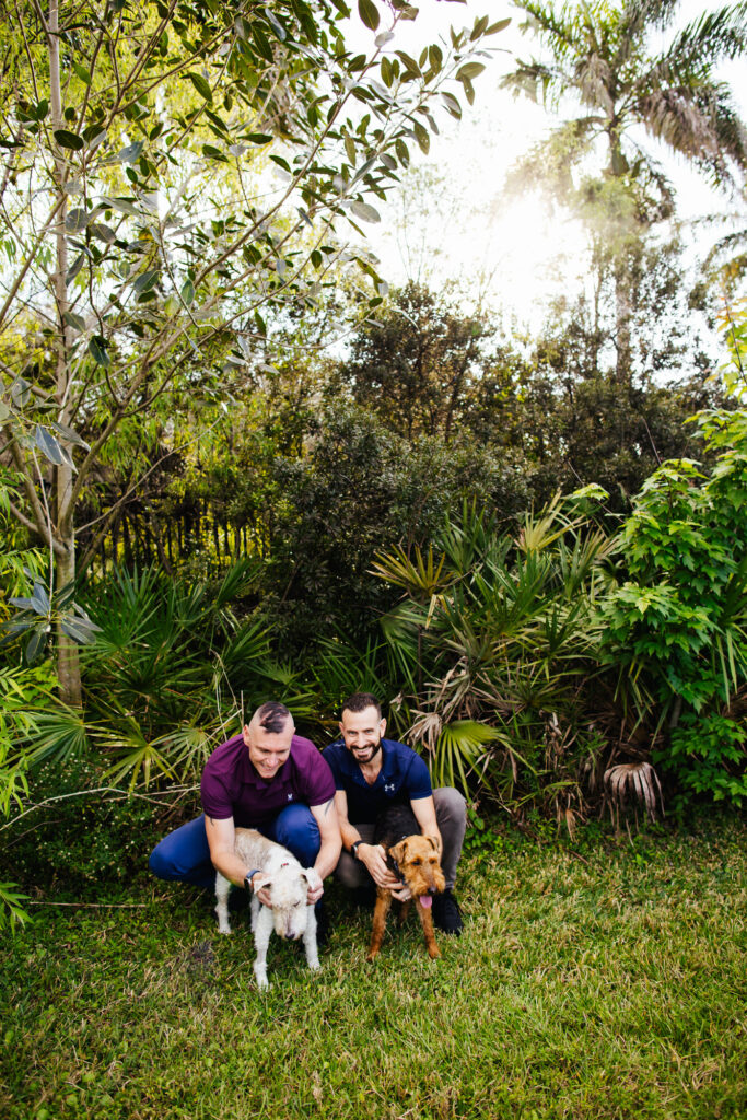 LGBTQ+ Couple with their two dogs at Wilton Manors Park