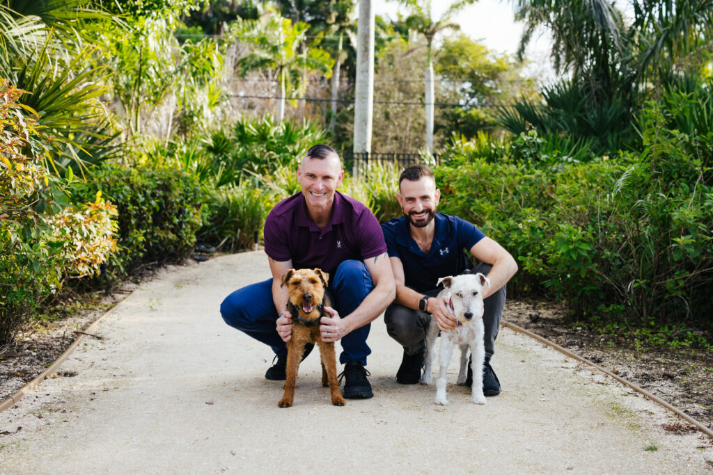 LGBTQ+ Couple with their two dogs at Wilton Manors Park