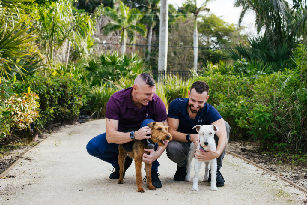 LGBTQ+ Couple with their two dogs at Wilton Manors Park