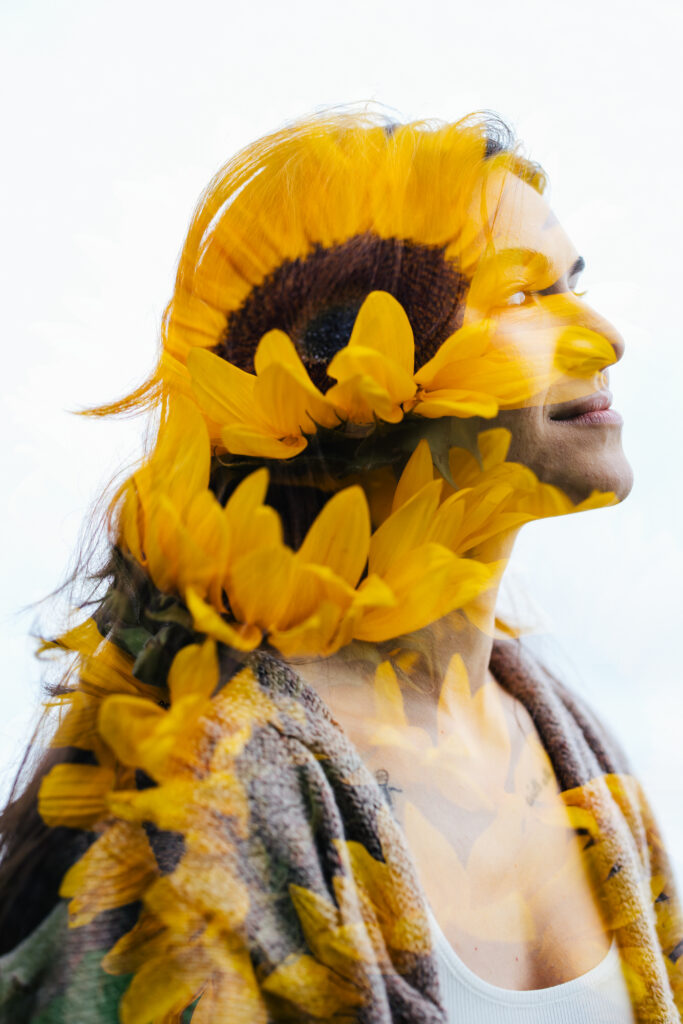 Double Exposure of woman figure filled with sunflowers