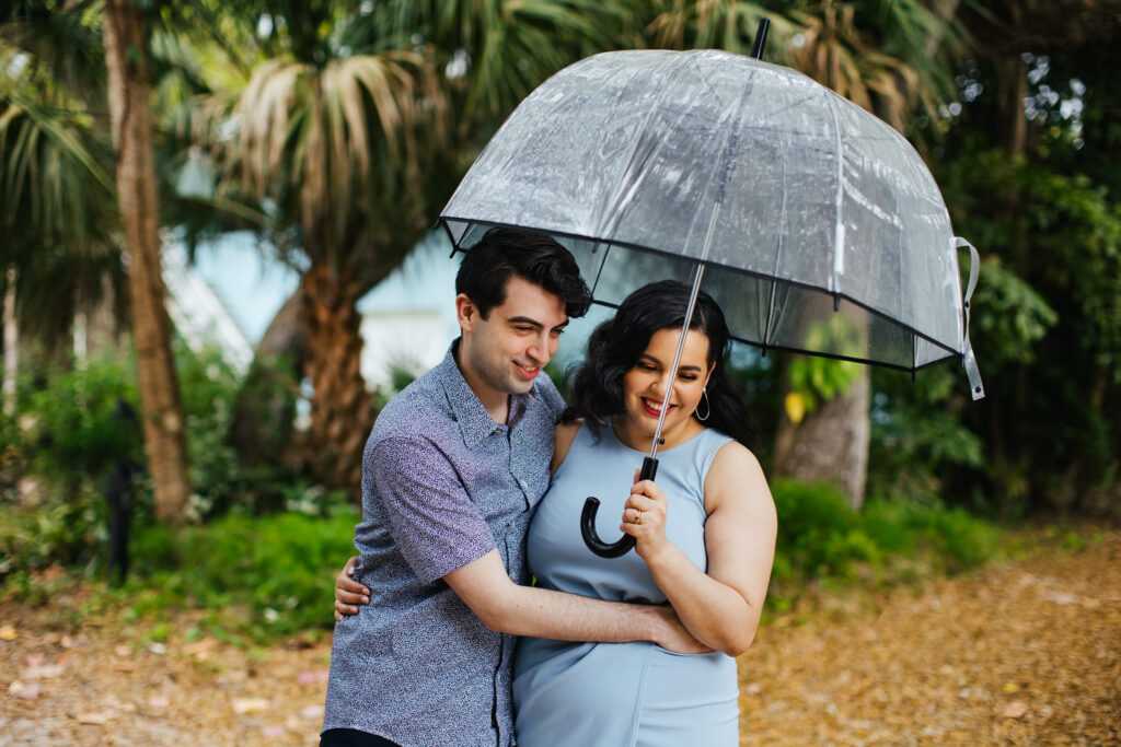 Quirky Couple posing for Engagement Portraits in Vero Beach by Tiny House Photo